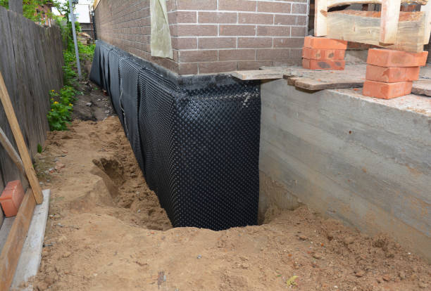 Happy homeowners after waterproofing job in Pompton Plains